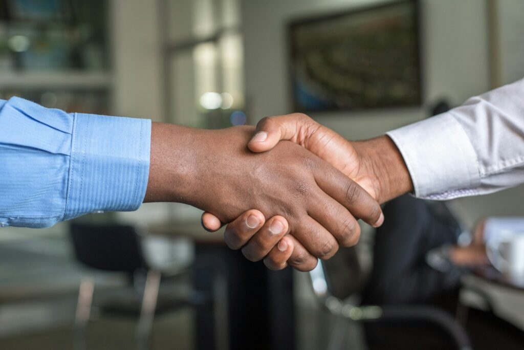 photo of a handshake representing outsourcing