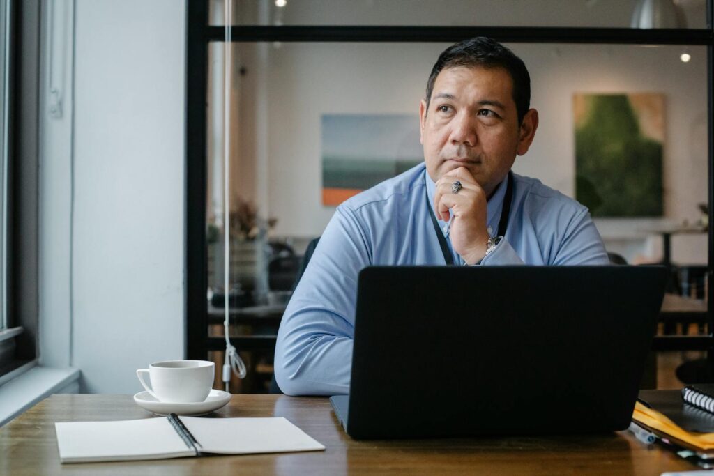 man thinking which adult seo service to choose